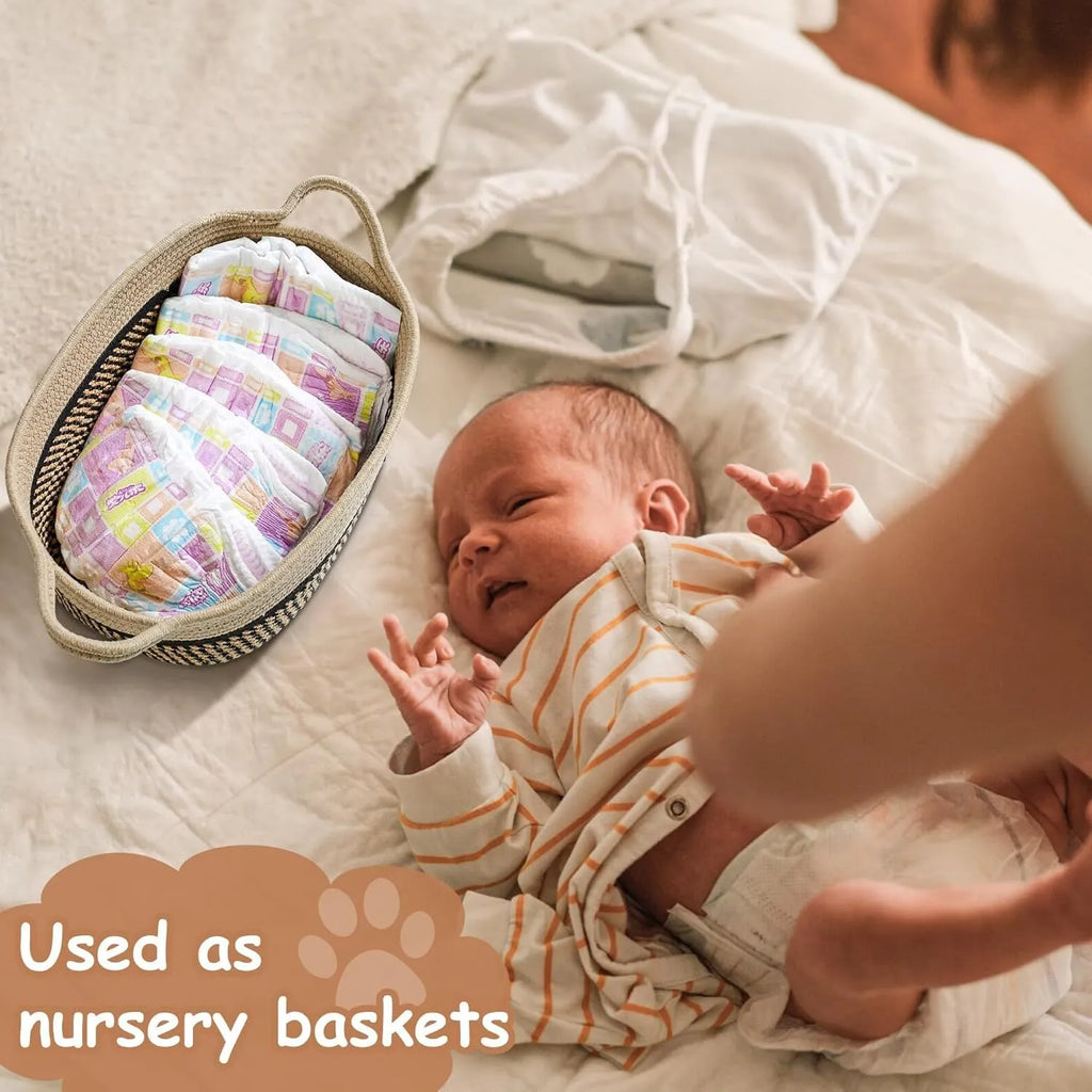 Handmade light beige woven cotton rope storage basket with wood and a handle.