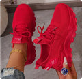 Women's low-top casual mesh sports shoes in a solid colour with lace-up front.