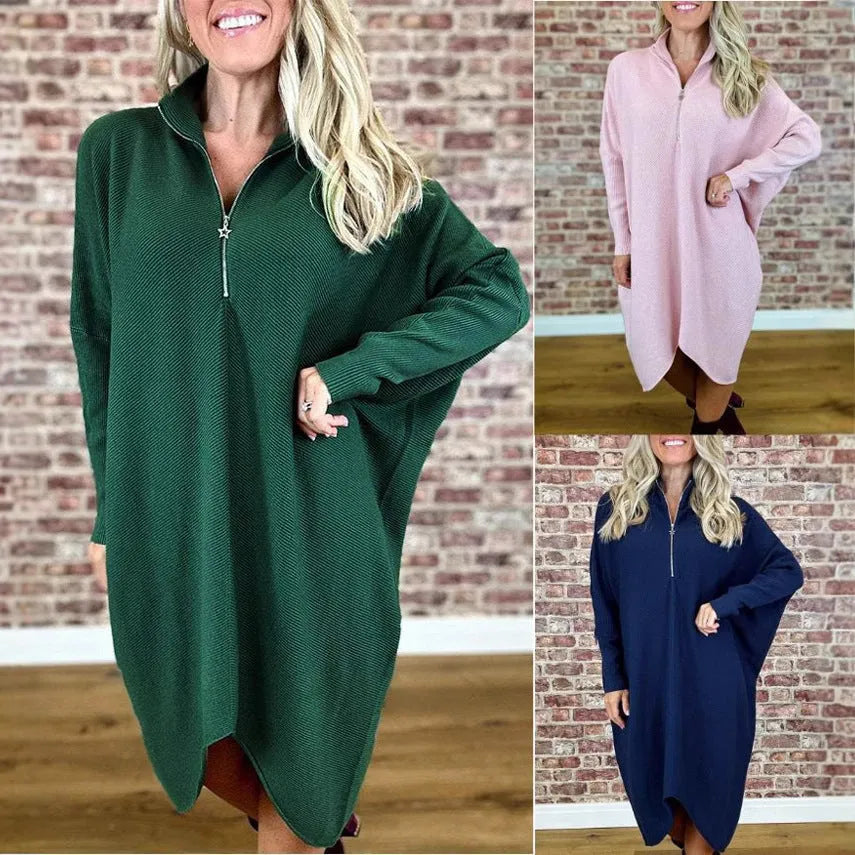 Women's solid colour loose fit knitted dress with raglan sleeves and a front zipper detail.