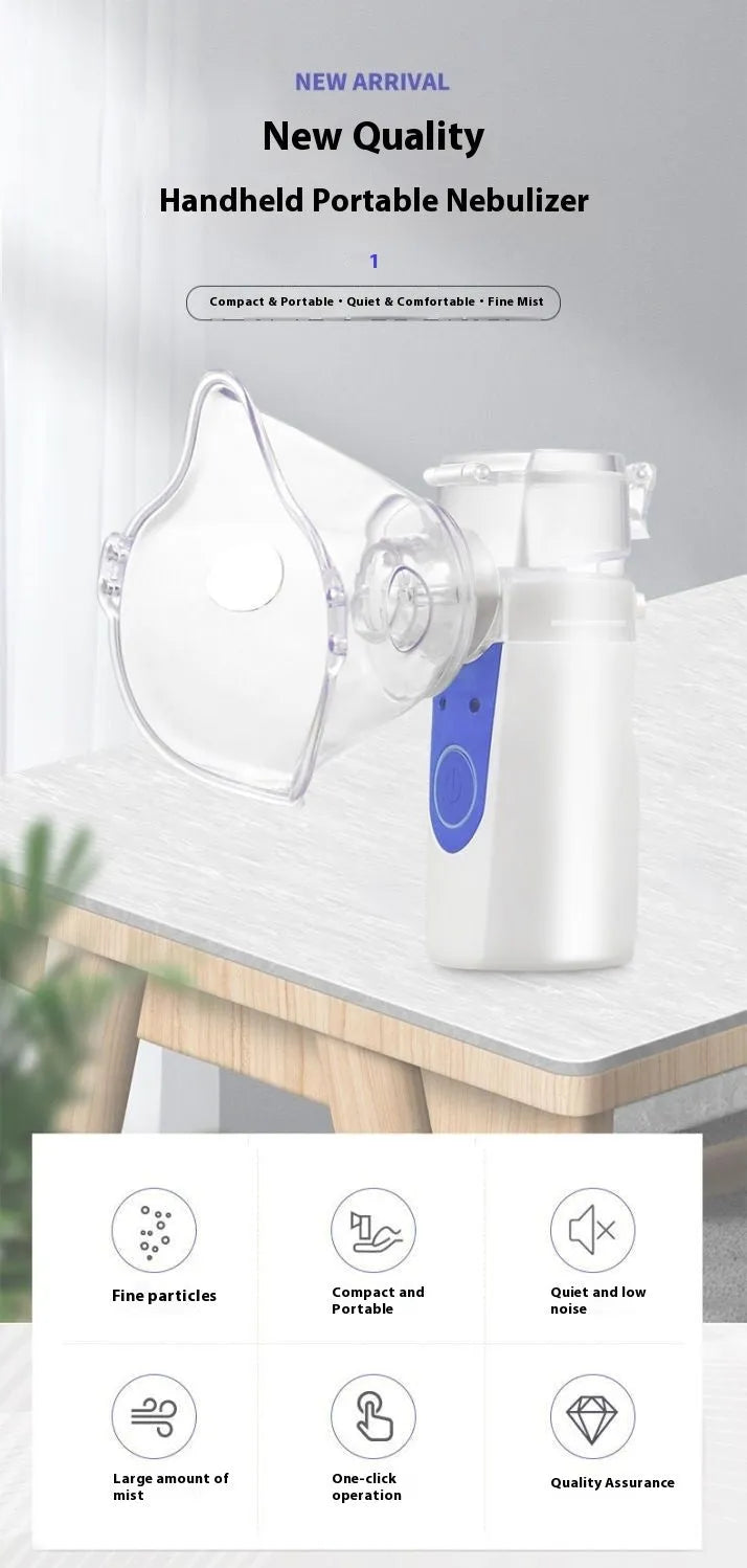 White columnar plastic USB handheld nebuliser spray machine with water tank on a table.