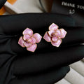 Gold plated purple oil-spot glaze floral stud earrings on copper base.