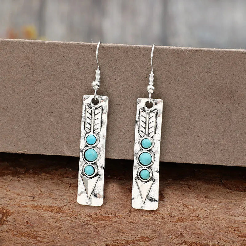 Long geometric silver earrings with turquoise inlays, zinc alloy construction