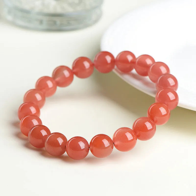 Natural South Red Cherry Agate scattered bead bracelet showing cherry red colour and polished surface