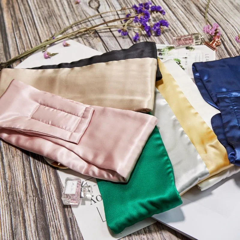 Silk sleep eye mask in multiple colours including champagne gold and navy blue.