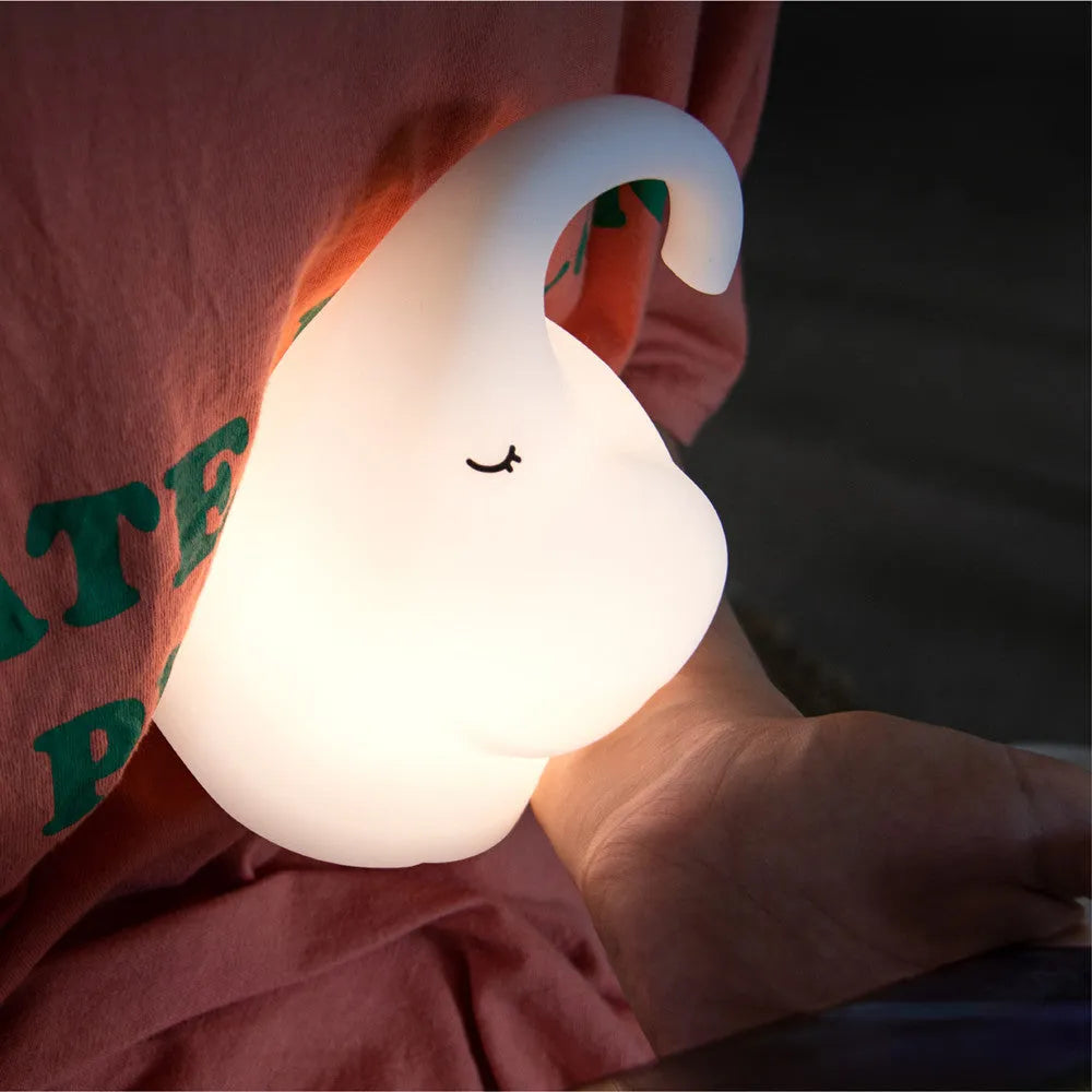 DOMI Elephant silicone night light with soft white LED glow on bedside table