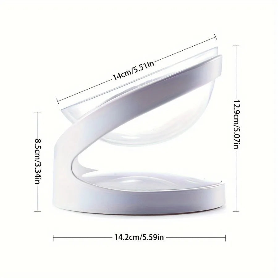 Clear plastic tilted cat food bowl for ergonomic feeding and neck protection