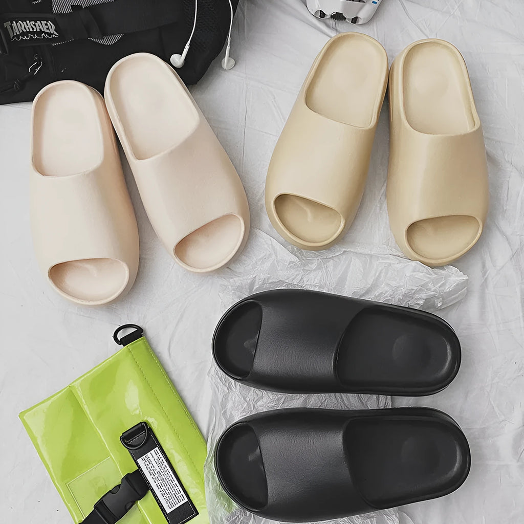 Women's thick-soled EVA beach slippers in beige, black, brown, or green on a plain background.