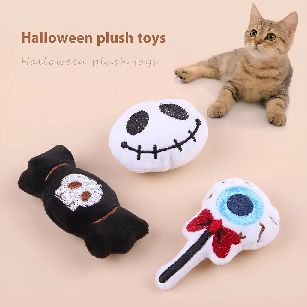 Small cat teaser wand with candy, eyes and skull plush attachments