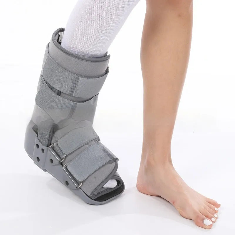 A black Achilles tendon rehabilitation boot with fixed support, showing straps and structural design.