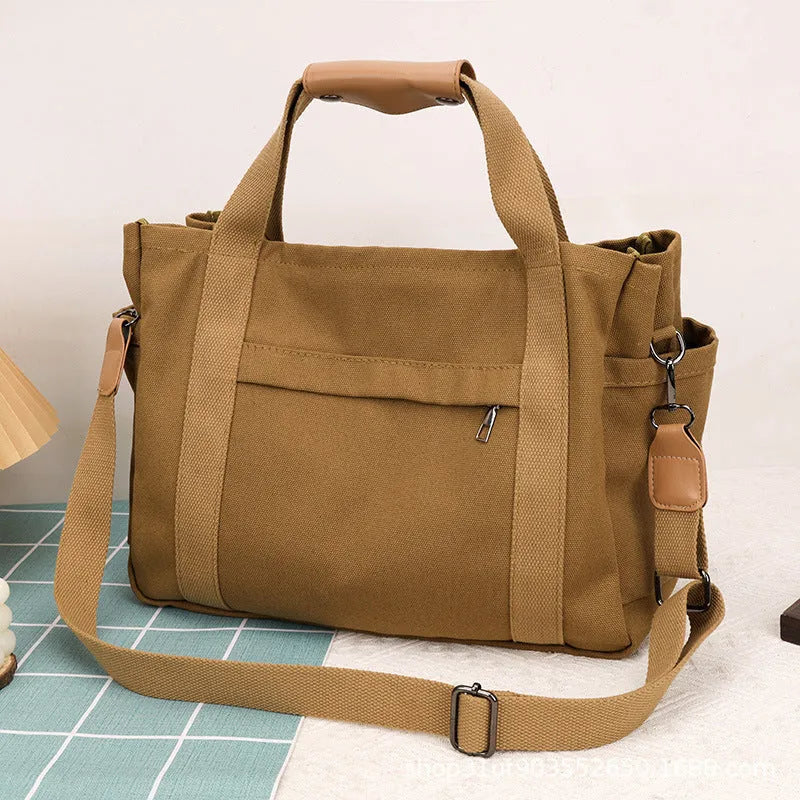 Large capacity canvas tote bag with internal organisation pockets and open on both sides zipper closure