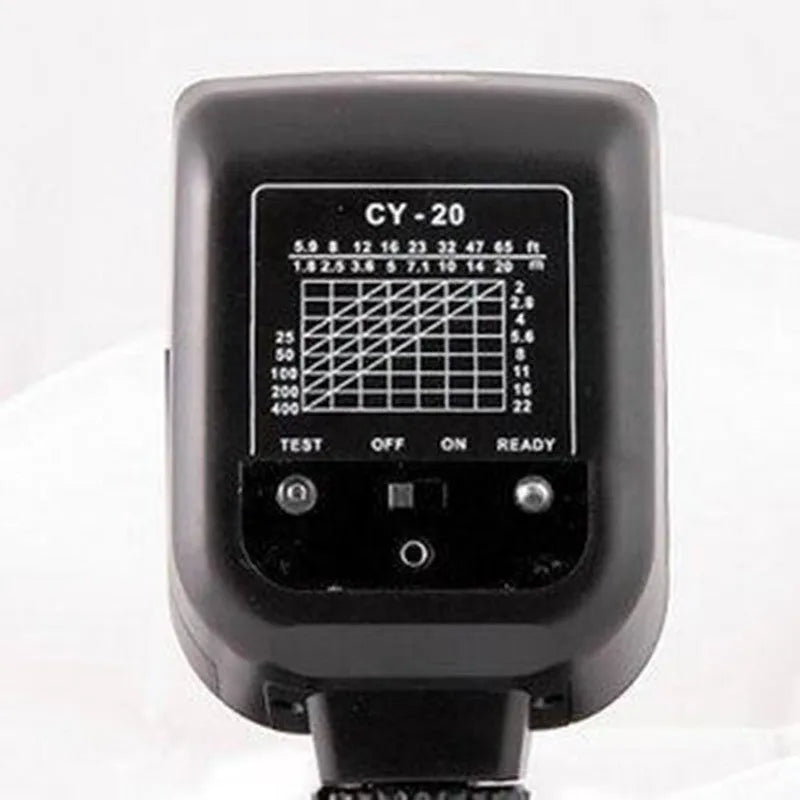 SLR camera flash accessory with tilted head shown on a hot shoe, displaying compact size.