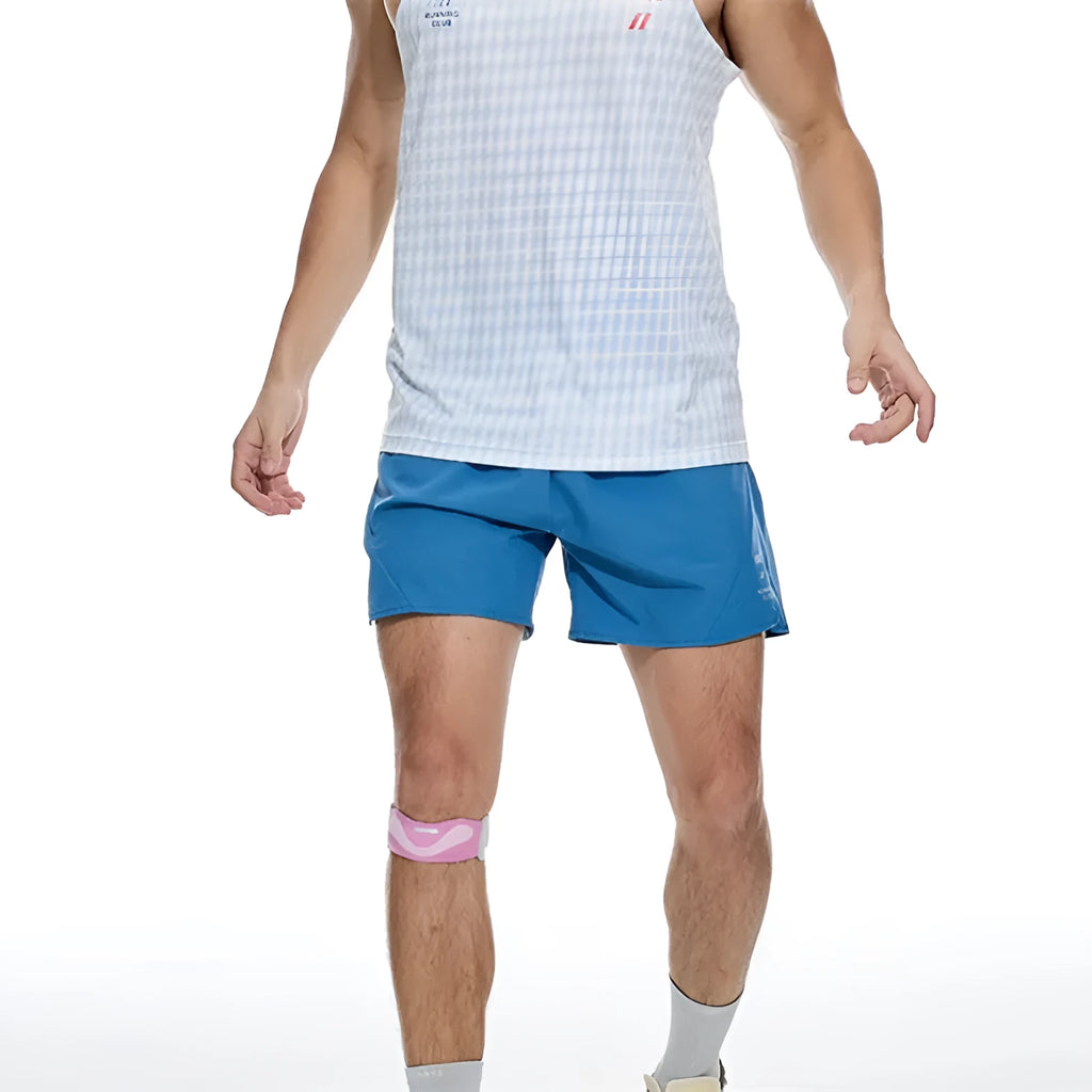 Men's black four-point running shorts with laser stitching on a flat surface, showing stretch fabric.
