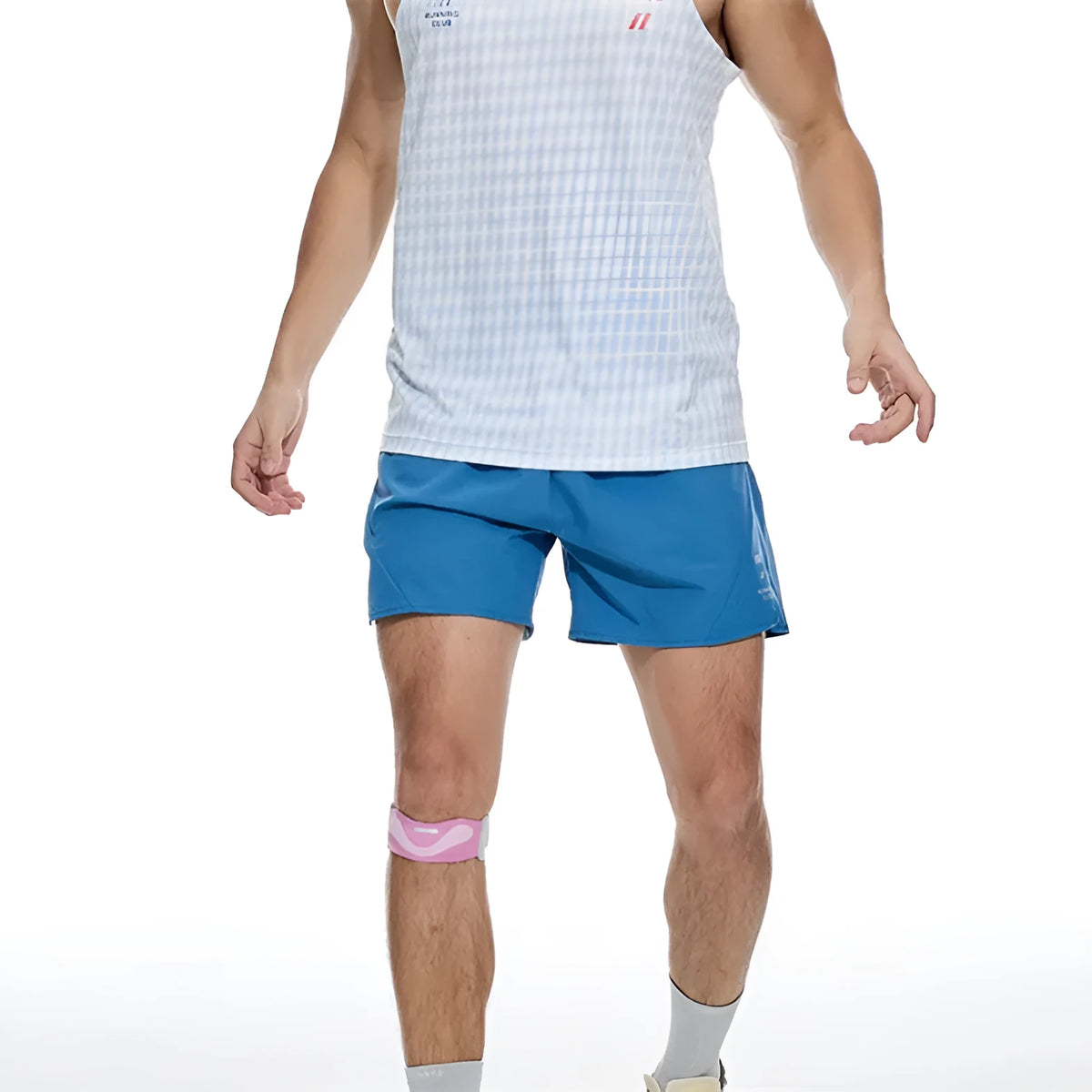 Men's black four-point running shorts with laser stitching on a flat surface, showing stretch fabric.