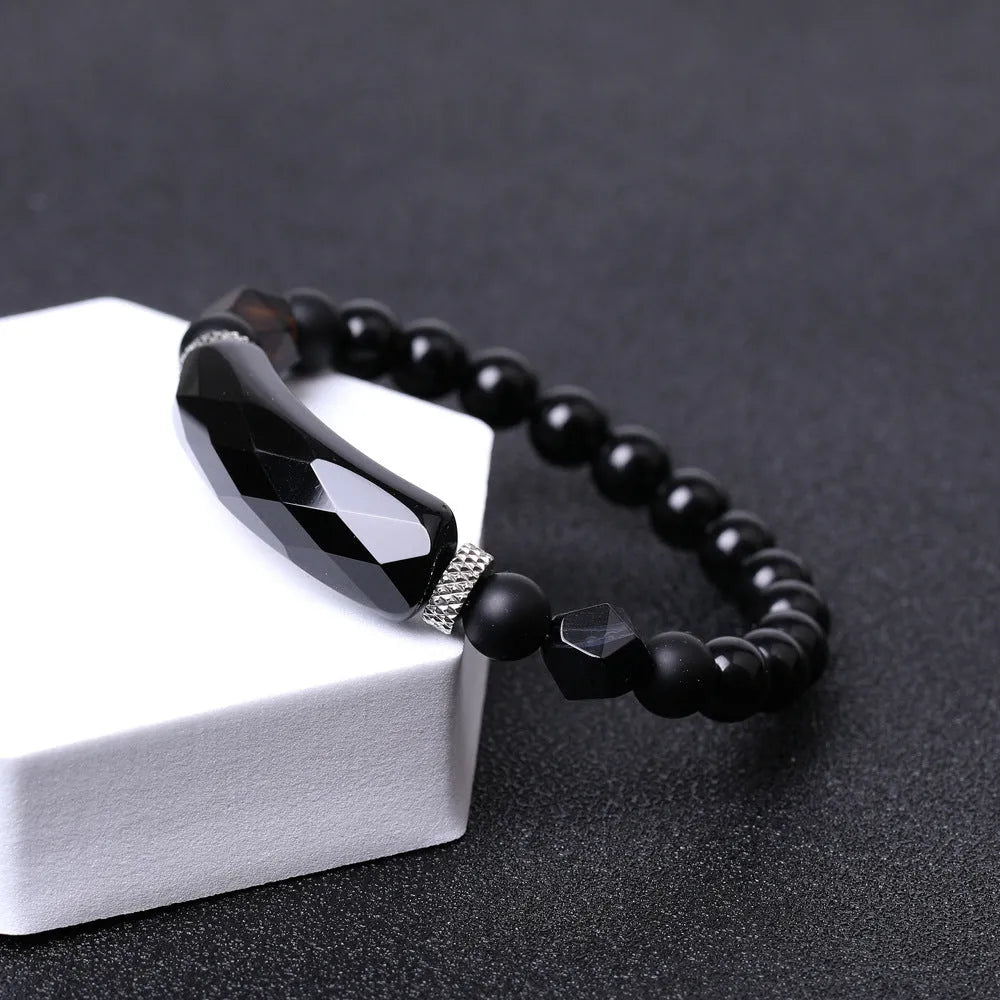 Diamond-shaped cut black agate bracelet showing geometric fan design and handmade craftsmanship