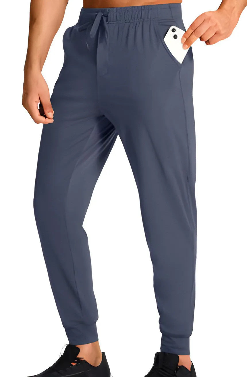 Man wearing solid colour loose-fit casual polyester trousers for leisure activities.