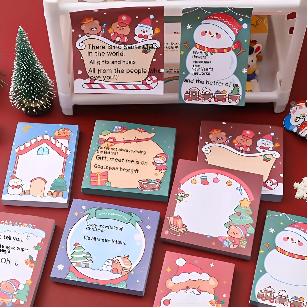 Christmas sticky notes showing eight cartoon designs including Santa Claus, elves, snowmen, and holiday gifts