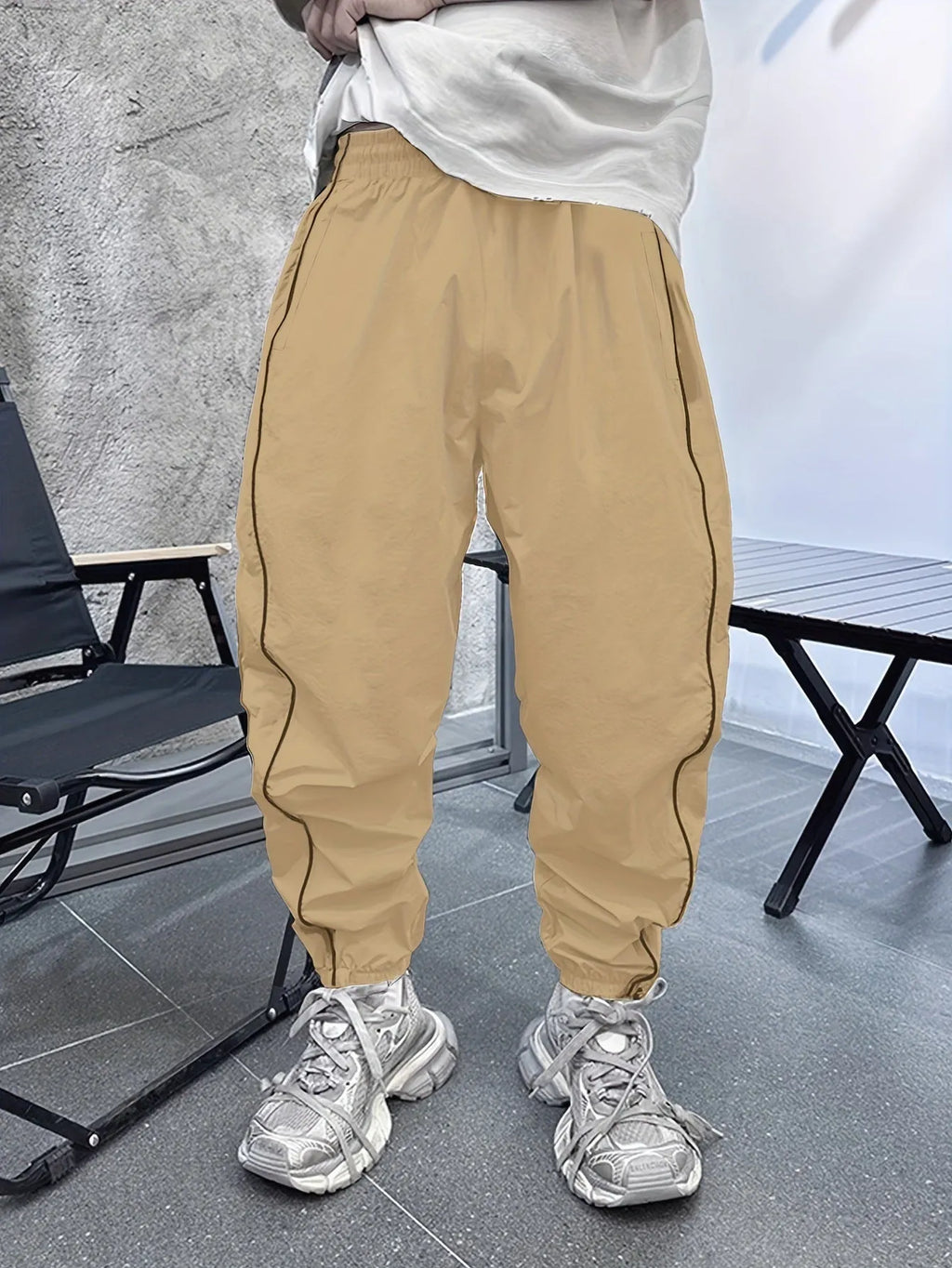 Men's loose fit cropped sports trousers in bamboo fibre, shown in khaki colour.
