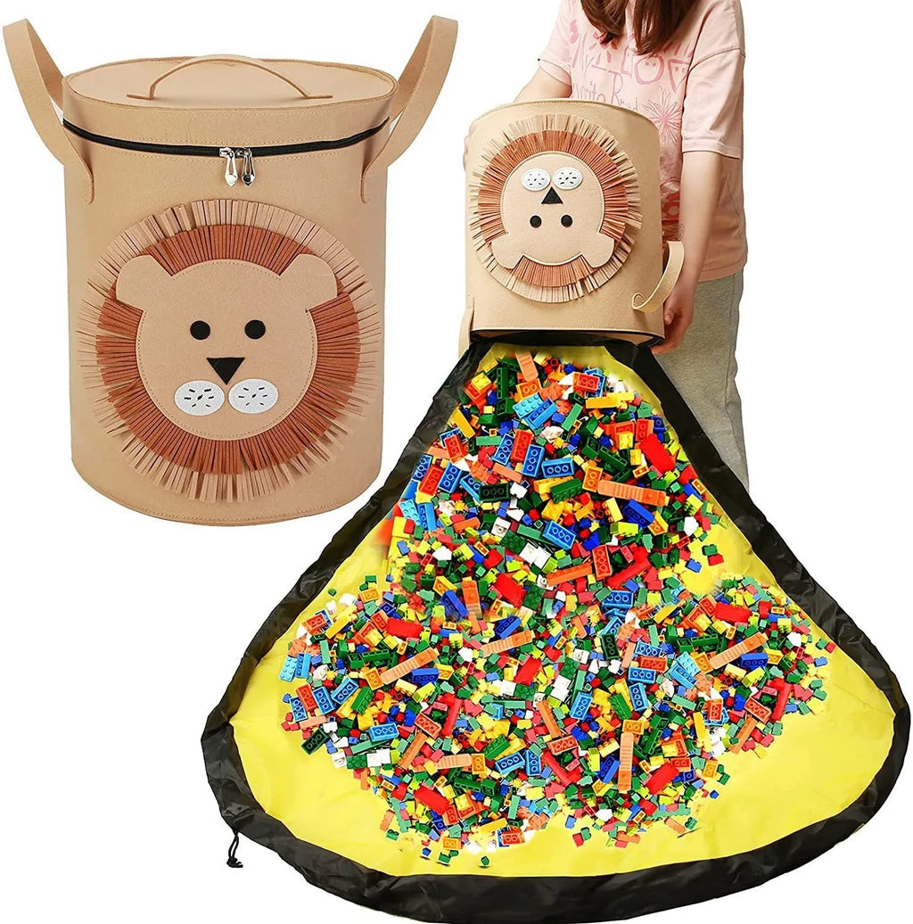 Green cube-shaped felt storage bag with pull rope, laid flat as a play mat.