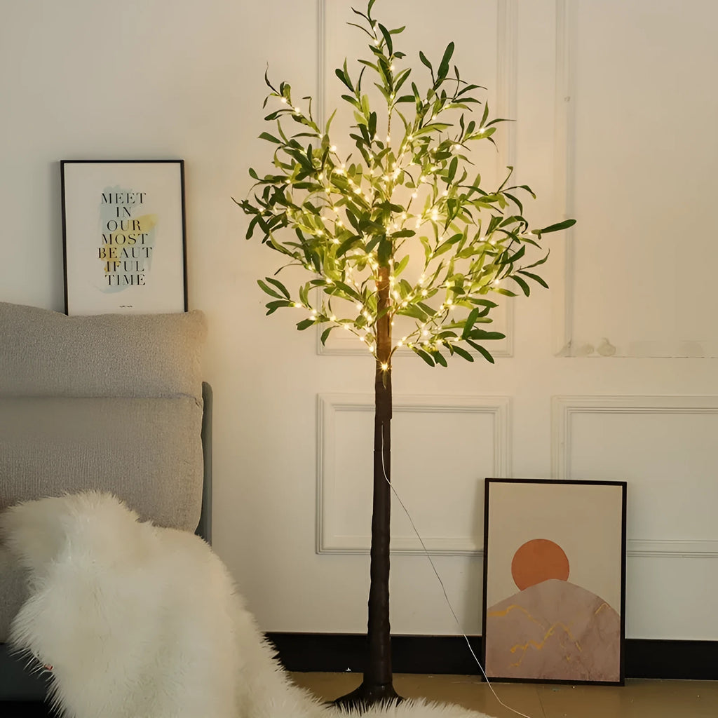 Tall 1.8m artificial olive tree lamp with warm white LEDs illuminating simulation leaves in a courtyard setting.