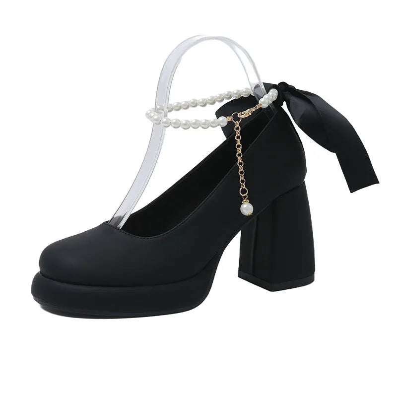 Beige women's Mary Jane shoes with chunky heel and ankle strap buckle on a white background