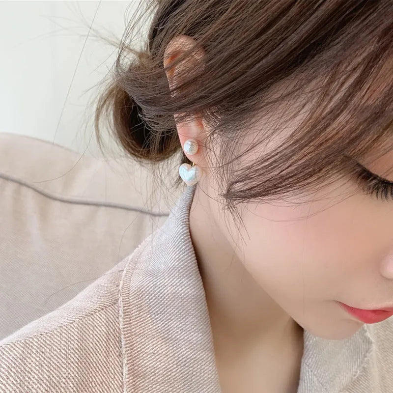 Heart-shaped pearl stud earrings with artificial gemstone accents on electroplated alloy settings