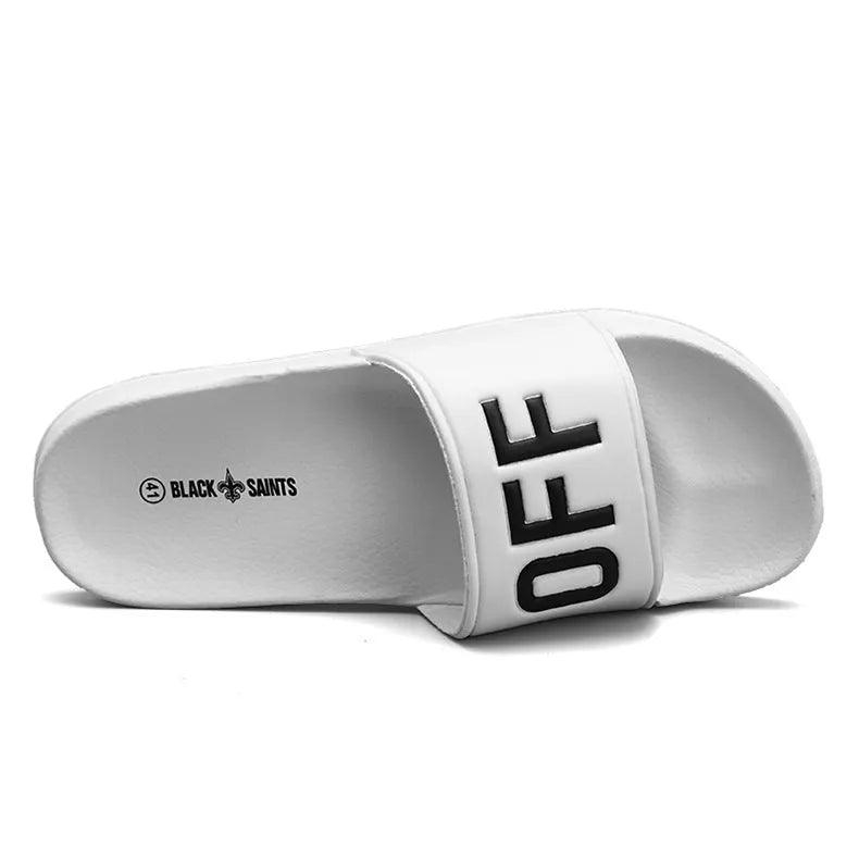 Large size men's black open toe slippers with a rubber sole, shown from the side.