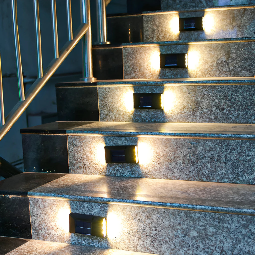 Solar-powered outdoor wall light with upward and downward LED illumination for garden decorative lighting