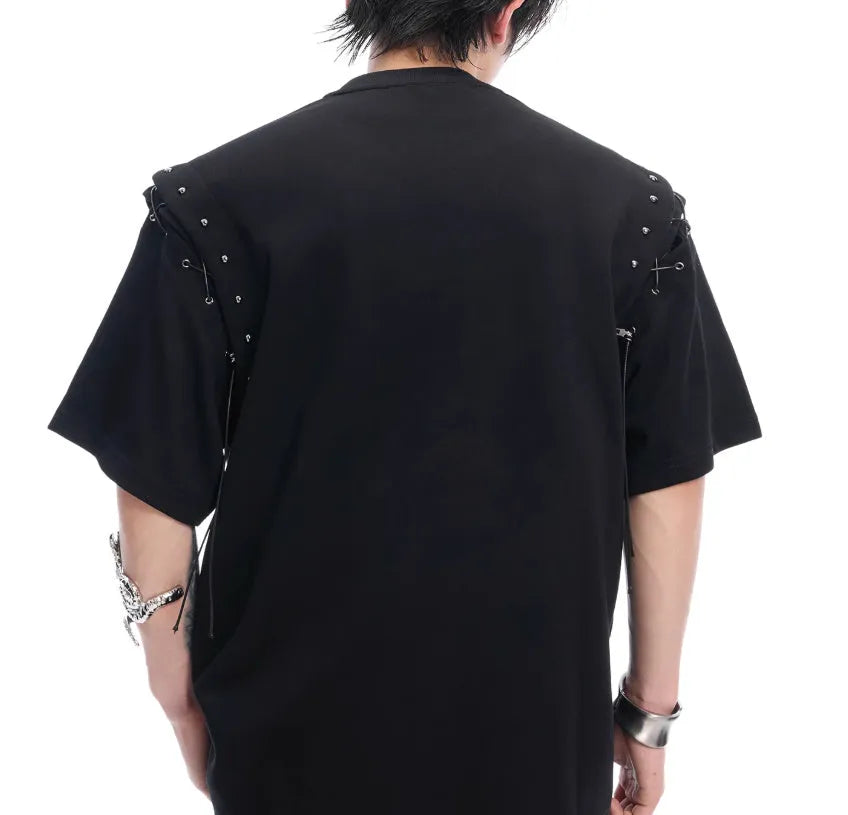 Women's black short sleeve top with a white lace-up cutout detail on the side.