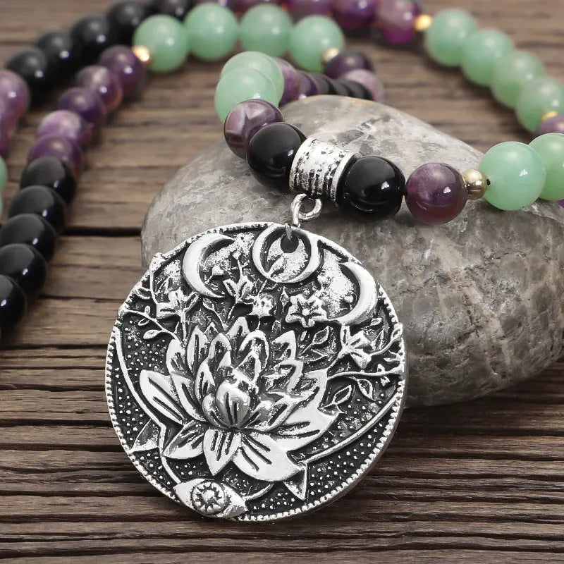 Yoga lotus pendant necklace and bracelet set with stone beads and geometric alloy pendant on adjustable chain.