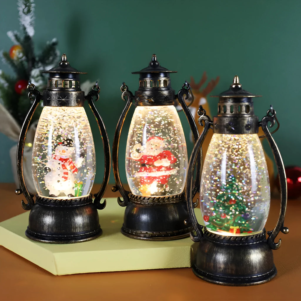 Clear plastic crystal ball oil lamp with LED light, showing snowman and elderly figure design options.