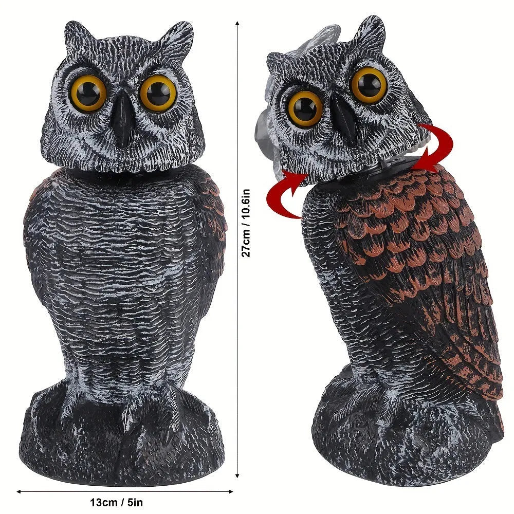 Polyethylene artificial owl bird scarer ornament with moving head, shown in a garden setting.