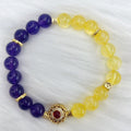 Handmade women's yellow and purple amethyst crystal bracelet with handcrafted details
