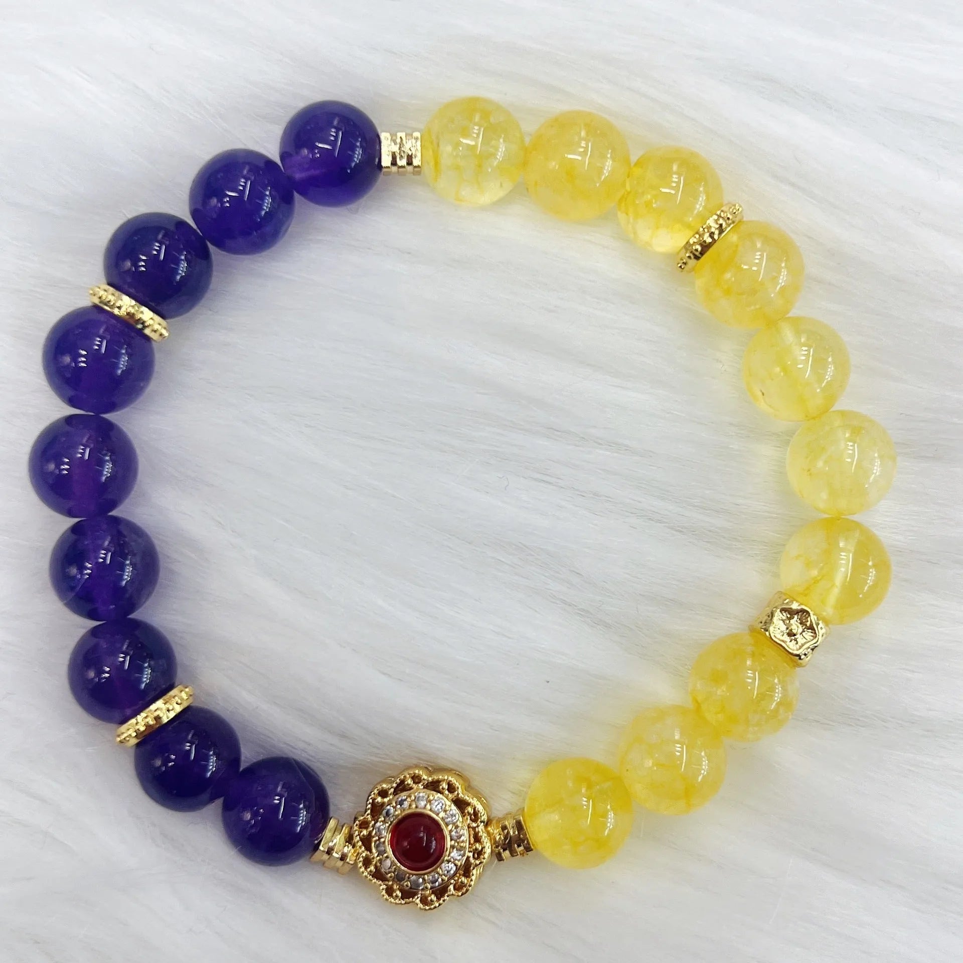 Handmade women's yellow and purple amethyst crystal bracelet with handcrafted details