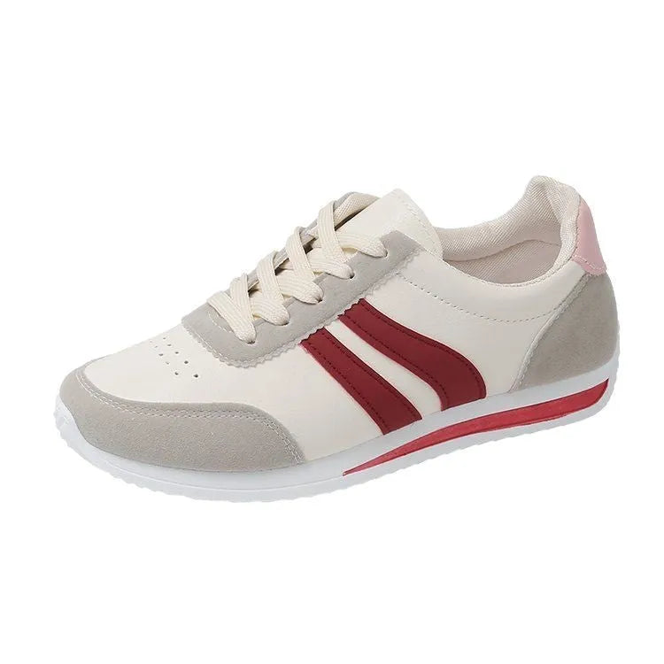 A pair of low-top red and blue lace-up running sneakers with a PU mesh upper and rubber sole on a white background.
