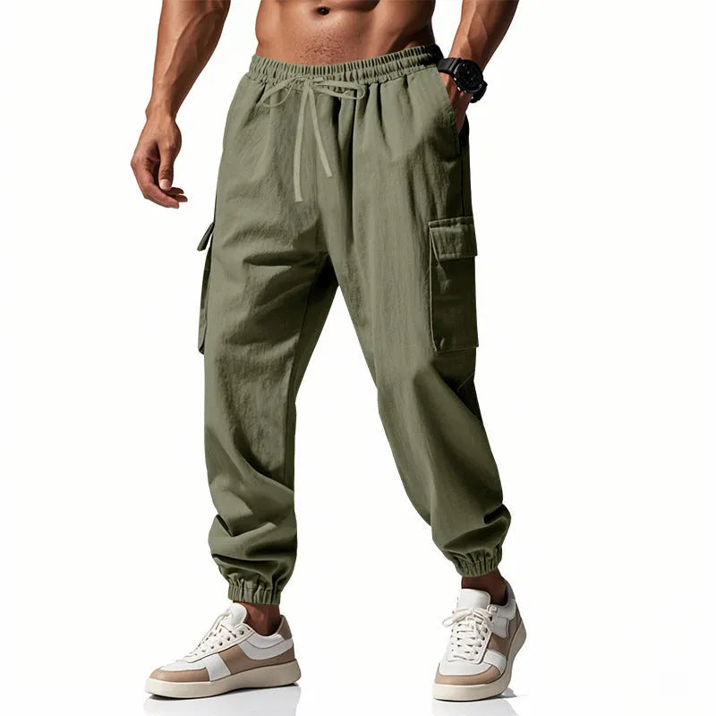 Men's loose fit linen trousers with ankle-tied hem and multiple pockets in army green.