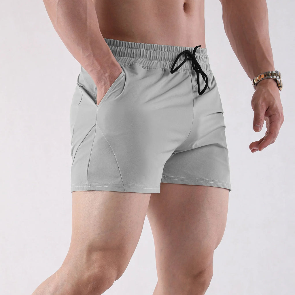 Men's thin basketball shorts in grey, black, apricot, or green with an elasticated waistband.