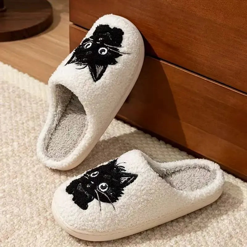 White plush cat cartoon patterned slippers with a non-slip sole.