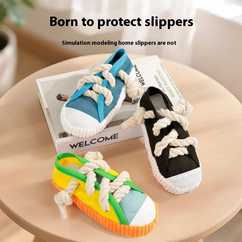 Plastic slipper-shaped dog chew toy with squeaker in yellow, black, or blue.