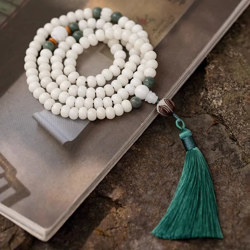 White jade Bodhi bead bracelet with 6x8mm beads in various decorative styles