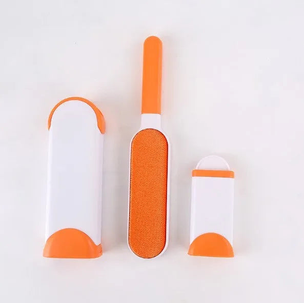 Blue reusable pet hair remover brush with self-cleaning base for removing fur from a grey sofa.
