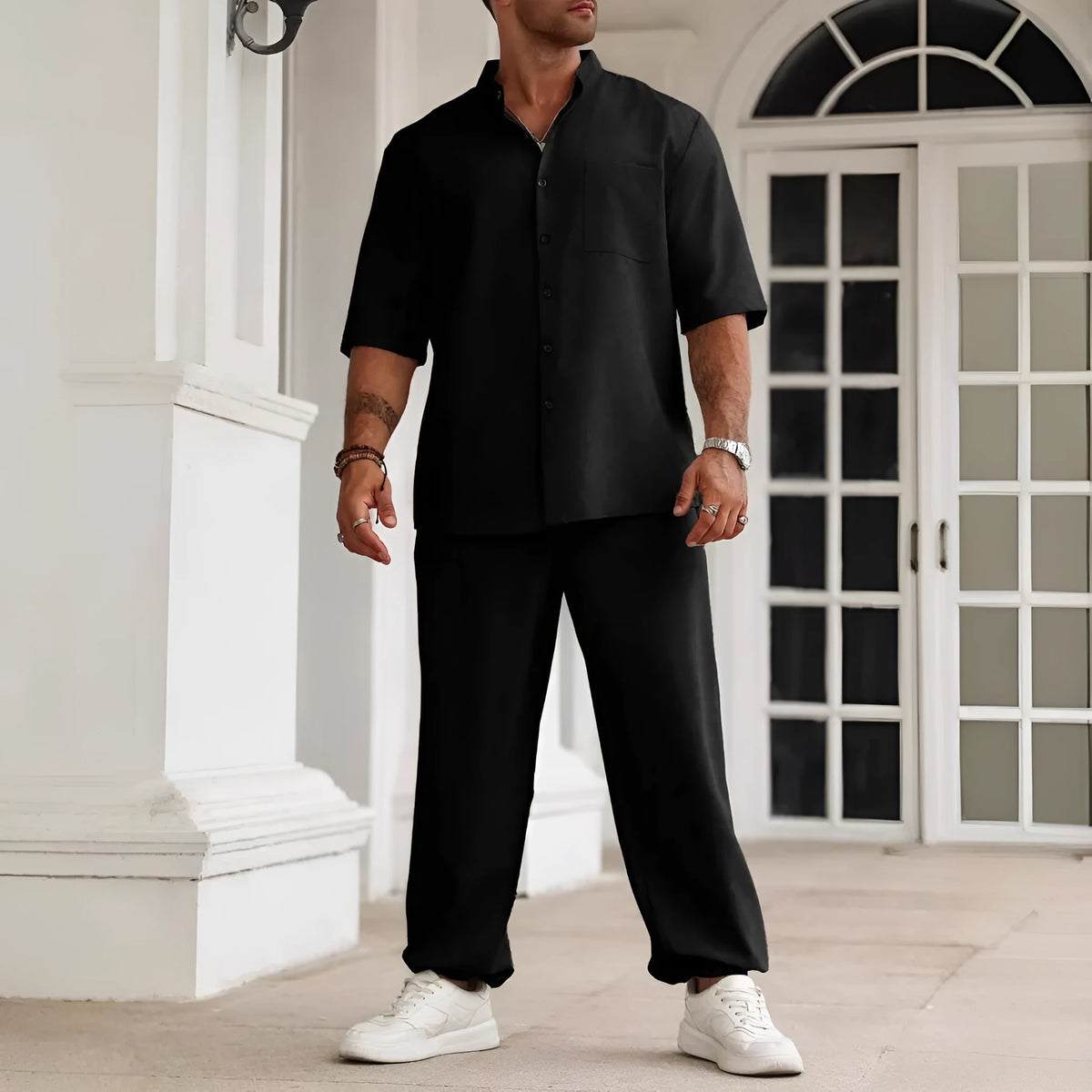 Men's casual apricot-coloured cotton linen short-sleeved shirt and trousers set laid flat.