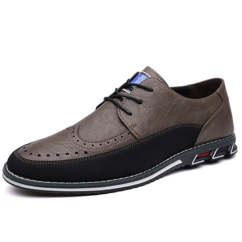 Men's black casual slip-on shoe with leather toe cap and decorative stitching on fabric upper.
