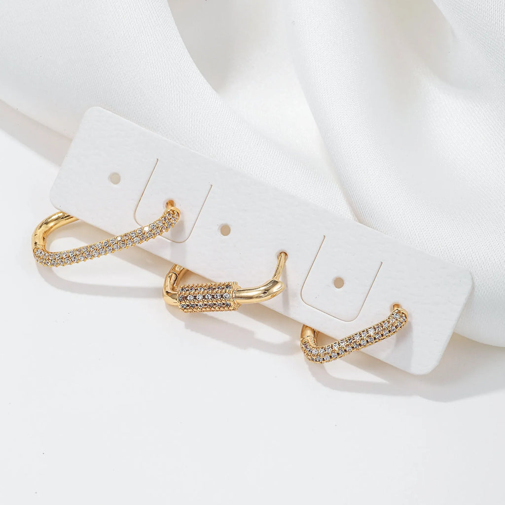 Three geometric ear clips with micro inlaid zircon stones in gold and white colour options