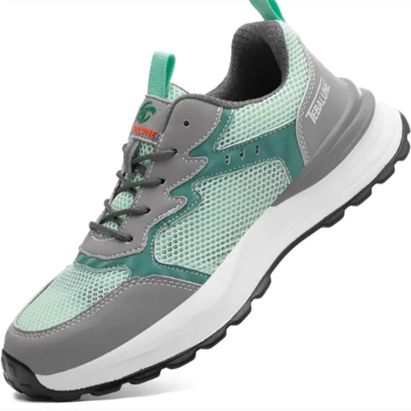 Green low-top work shoes with mesh panels and a plastic steel toe cap on a TPU sole