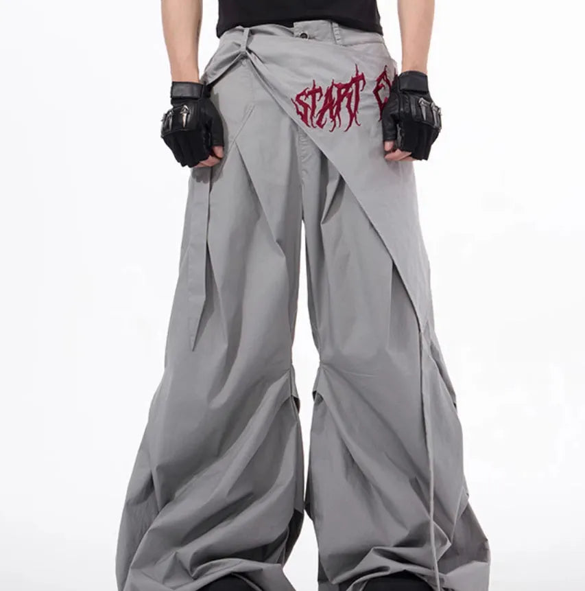 Boy wearing black wide-leg trousers in a refined Korean style, showcasing a casual and trendy look.