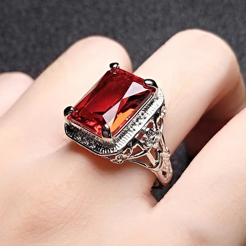 Women's geometric ring with pigeons-blood ruby in adjustable platinum colours
