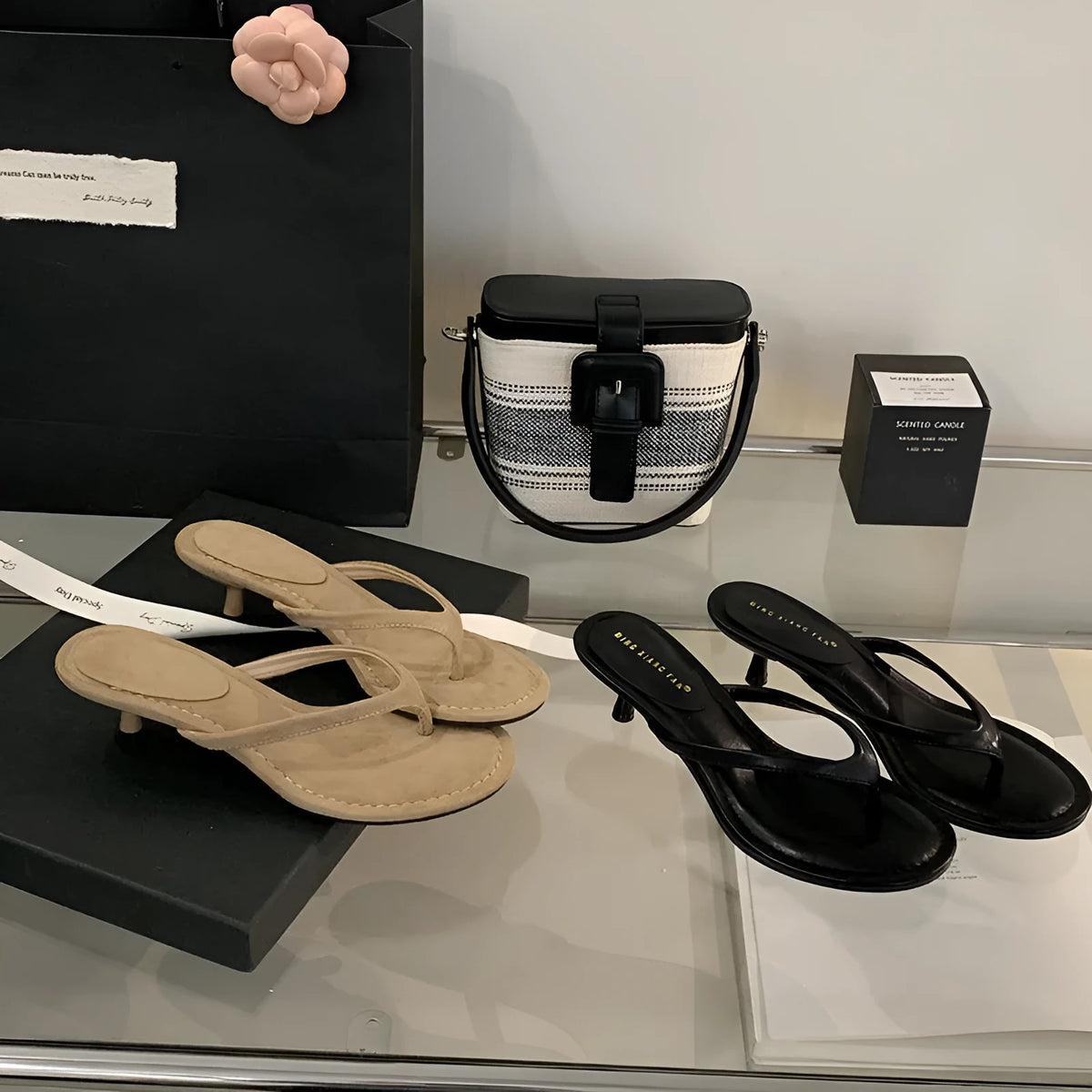 Women's round toe stiletto flip-flop sandals in black and camel colours on a rubber sole.