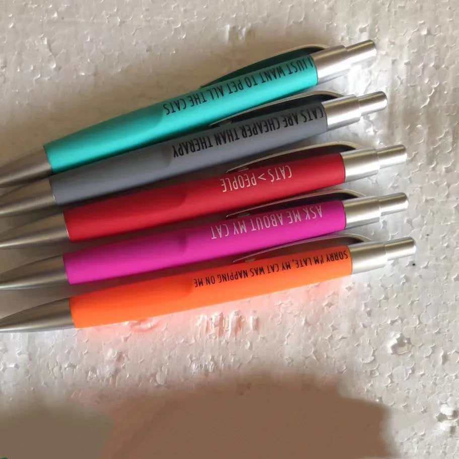 Set of five coloured push-action pens with cat or dog themes in beaded storage bag