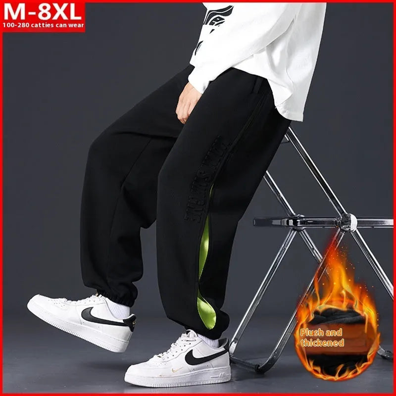 Men's loose-fit cotton trousers with stitching print detail and a banded ankle cuff.