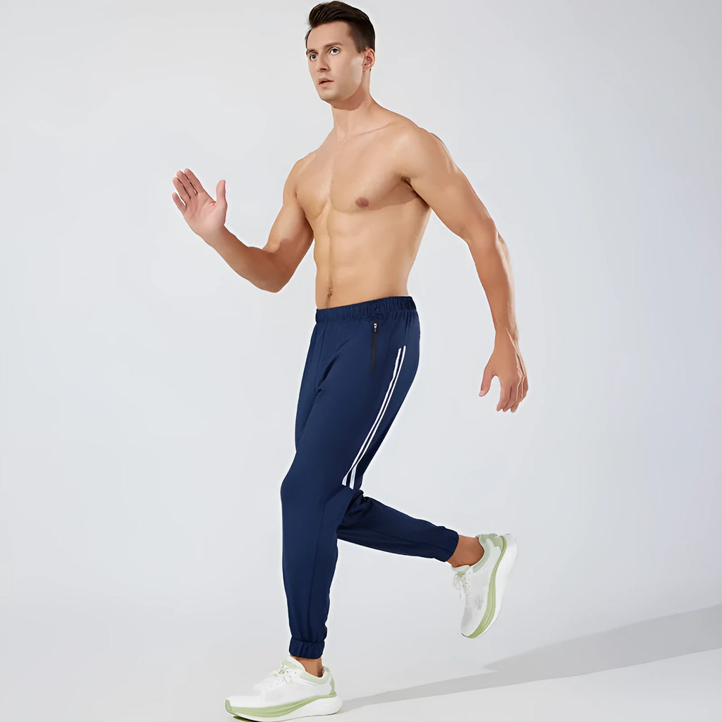 Men's black and navy blue running trousers with mid waist design and polyester fabric